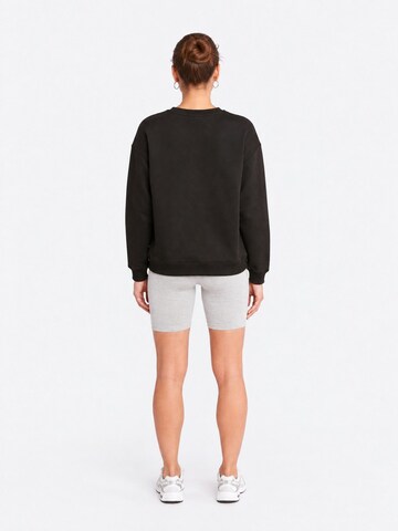 Sweat-shirt Ethiquet en noir