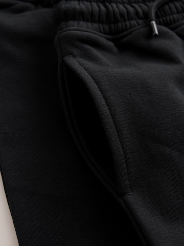 Next Zúžený Kalhoty – černá