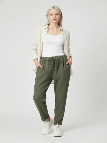 No Matter What Tapered Pleat-front trousers in Green: front