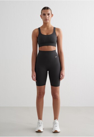 Skinny Pantaloni sportivi 'Ribbed Seamless' di Aim'n in grigio