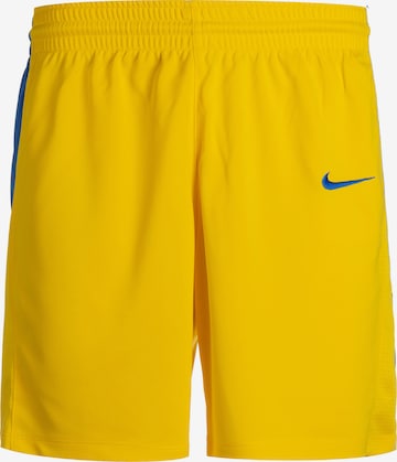 Loosefit Pantalon de sport NIKE en jaune : devant