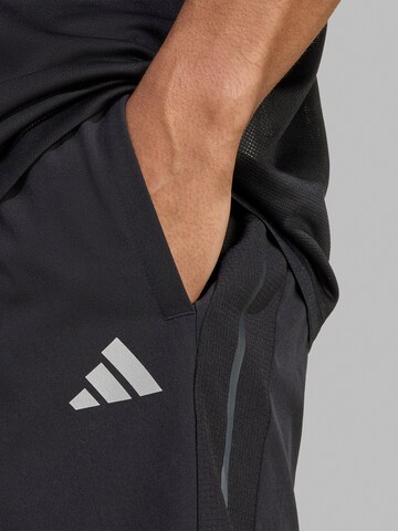 ADIDAS PERFORMANCE Loosefit Urheiluhousut 'Tech Apparel' värissä musta