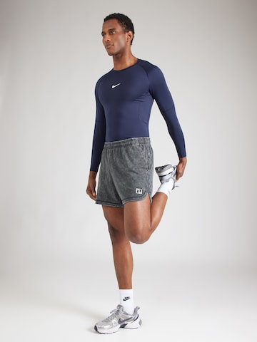 NIKE Normalny krój Spodnie sportowe 'HERITAGE' w kolorze zielony