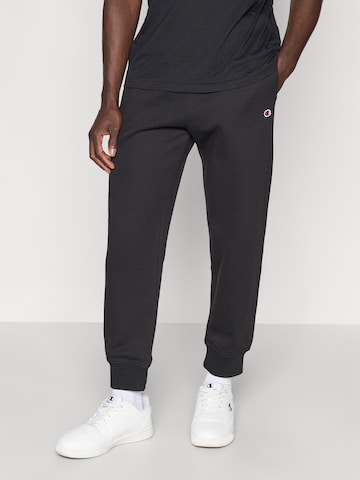 Champion Authentic Athletic Apparel Tapered Pants in Black: front