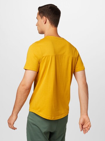 Reebok - Camisa funcionais em amarelo