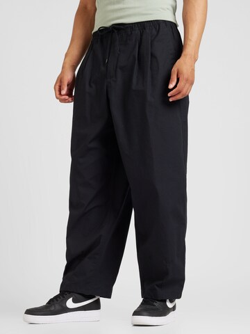 Loosefit Pantaloni 'CLUB' di Nike Sportswear in nero: frontale