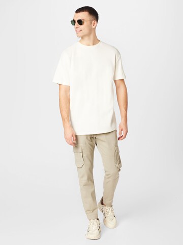 ALPHA INDUSTRIES Tapered Cargo trousers in Beige