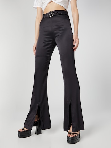 Katy Perry exclusive for ABOUT YOU Flared Trousers 'Nancy' in Black: front