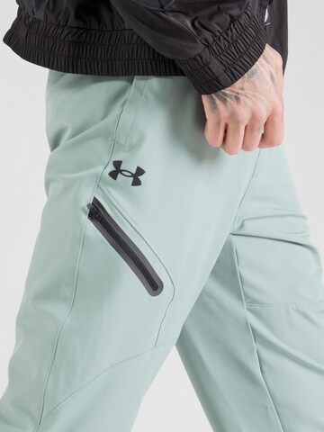 UNDER ARMOUR Zwężany krój Spodnie sportowe 'Unstoppable' w kolorze zielony