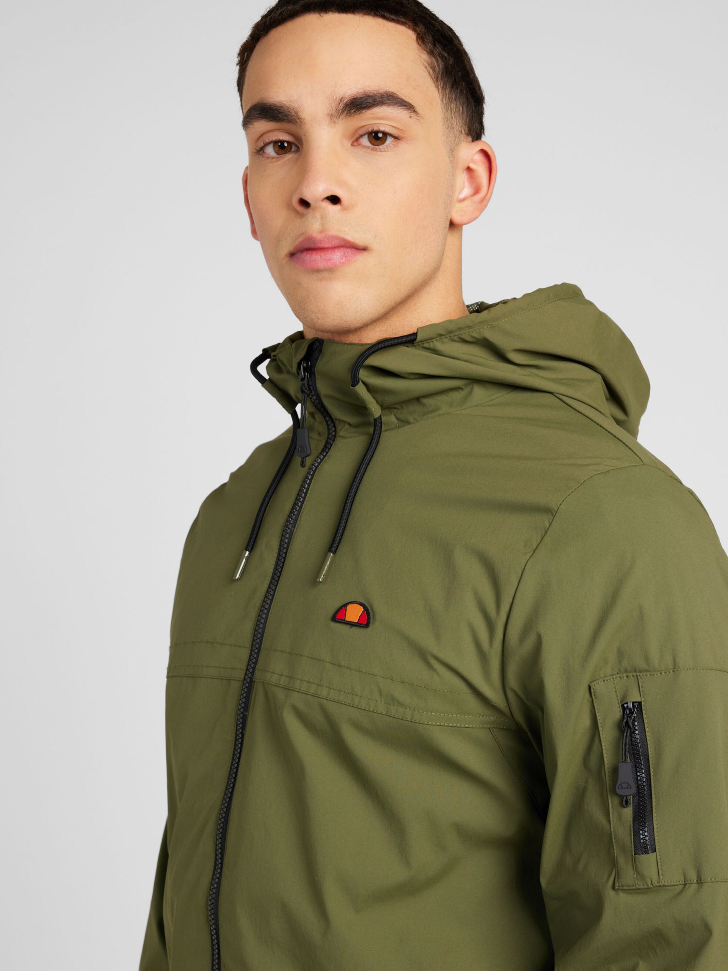 ELLESSE Between Season Jacket Battalio in Olive ABOUT YOU