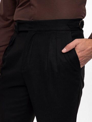 Antioch Tapered Pleat-front trousers in Black