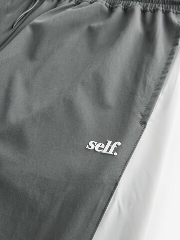 self. - Perna larga Calças em cinzento