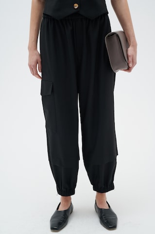 InWear Tapered Cargo Pants in Black: front