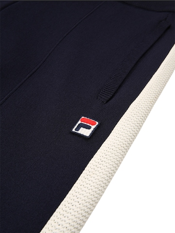 Loosefit Pantaloni 'CORTINA wide straight taped technical knit track pants' di FILA in blu