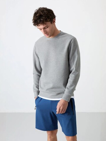 Sweat-shirt Tommy Life en gris