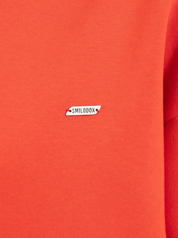 Veste de survêtement Smilodox en rouge