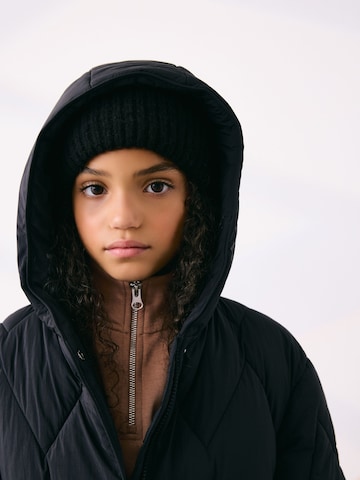 Next Mantel in Schwarz