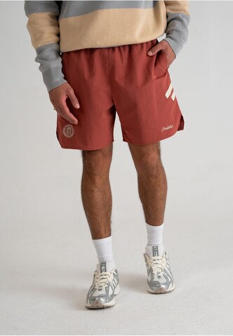 Prohibited Regular Pants 'PBFC' in Red: front