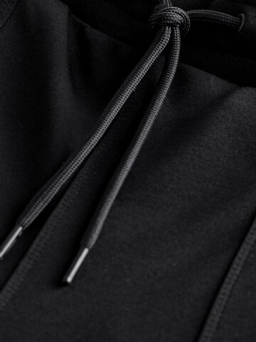 Next - Loosefit Pantalón en negro