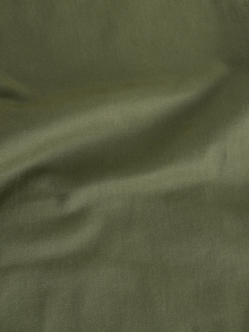 Next Slimfit Chinohousut värissä vihreä