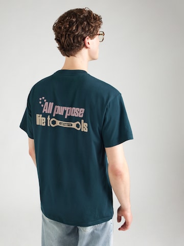 Tricou 'All Tools' de la Carhartt WIP pe verde: față
