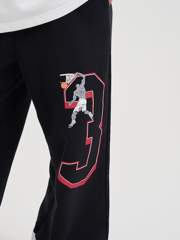 AND1 Loosefit Hose in Schwarz