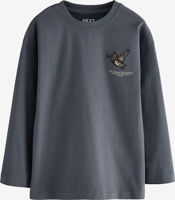 Next T-shirt i grå: framsida