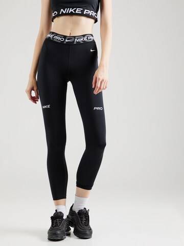 Skinny Pantaloni sportivi di NIKE in nero: frontale