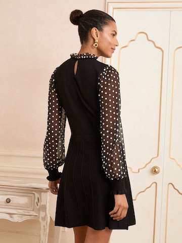 Robes en maille love & roses en noir