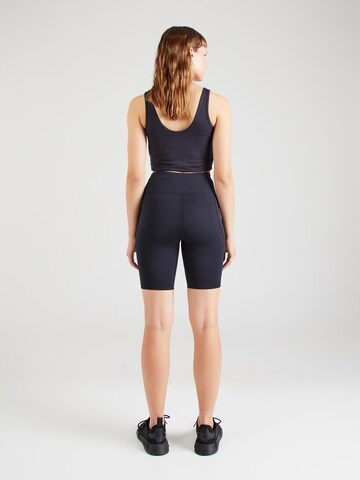 Skinny Pantalon de sport 'Motion' UNDER ARMOUR en noir
