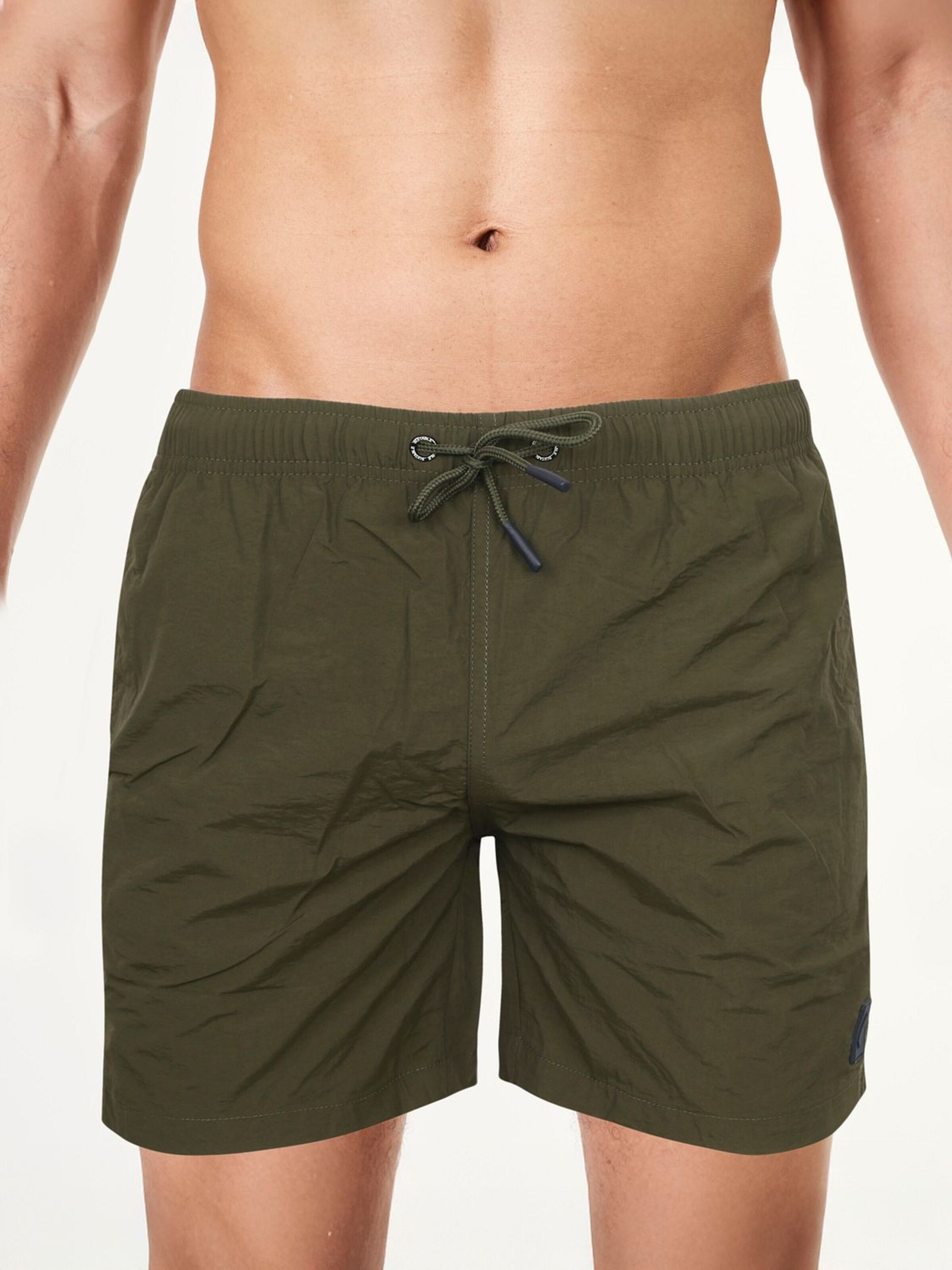 Suitable Board Shorts in Green: front