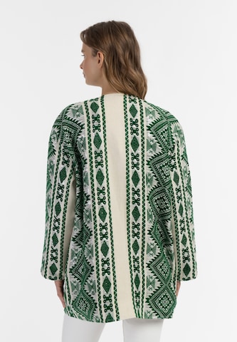 Geacă tricotată de la IZIA pe verde