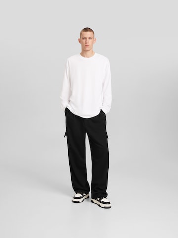 Bershka Loose fit Cargo trousers in Black