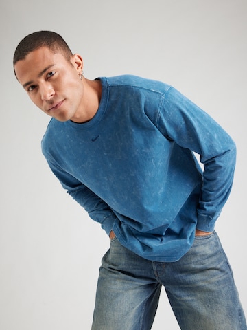 T-Shirt 'ESS' Nike Sportswear en bleu