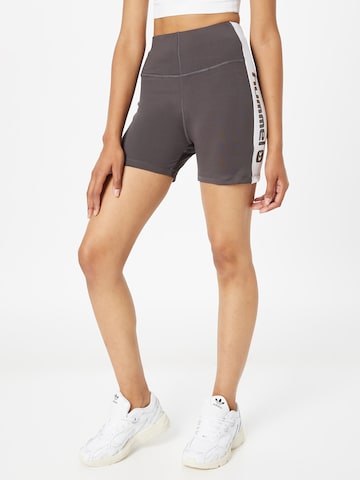 Hummel - Skinny Calças de desporto 'Zella' em cinzento: frente