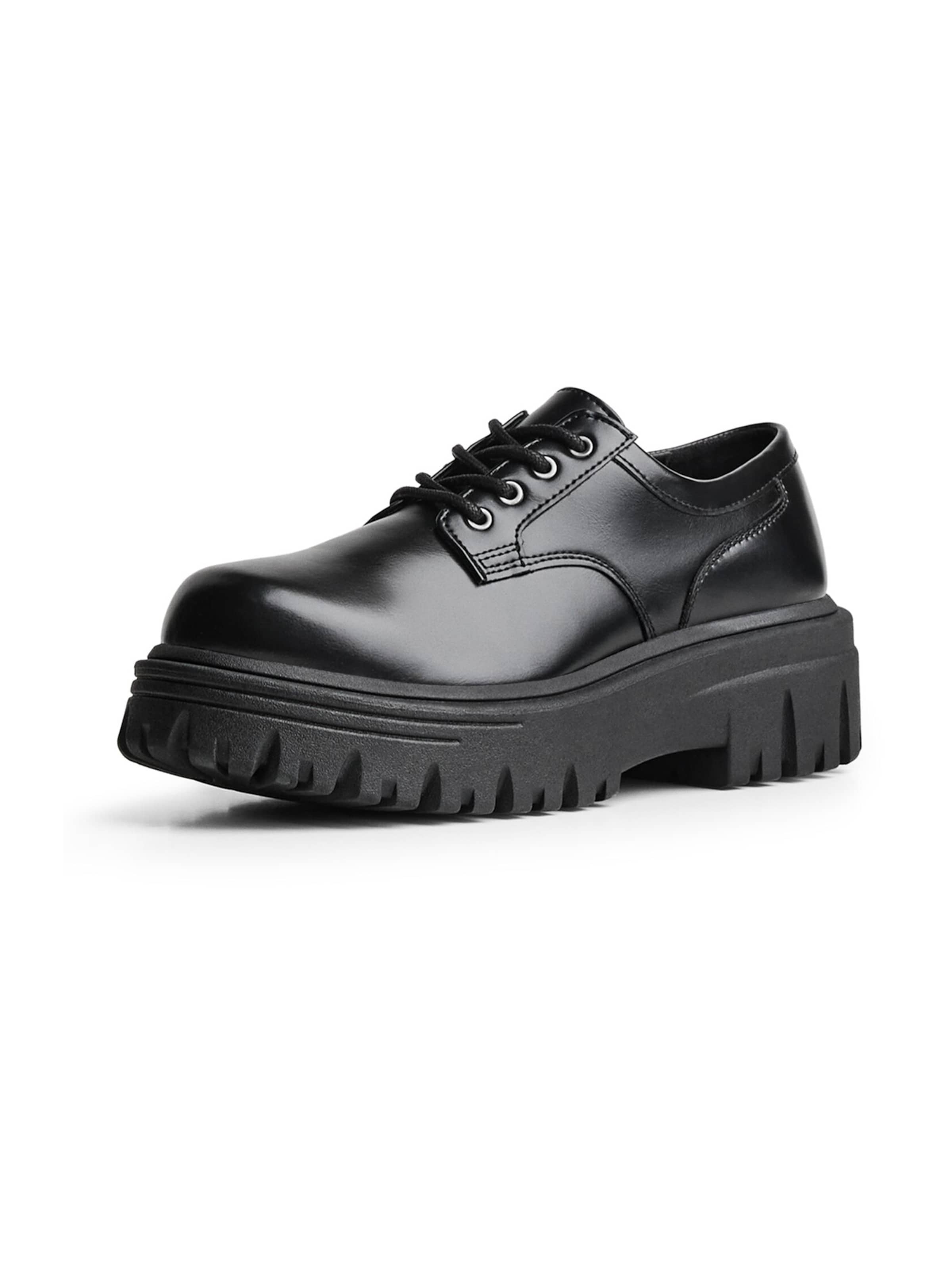 Bershka Slip-ons in Black: front