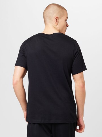 NIKE - Camiseta funcional en negro