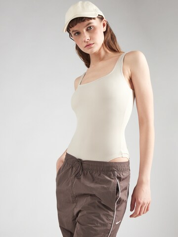 Girlfriend Collective Sports bodysuit in Beige: front