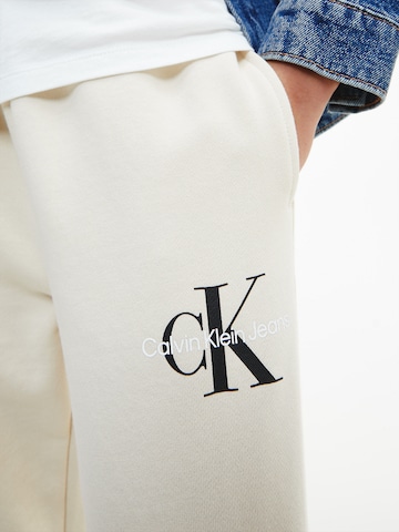 smėlio Calvin Klein Jeans Siaurėjantis Kelnės