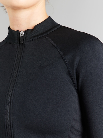 Bluză cu fermoar sport de la NIKE pe negru