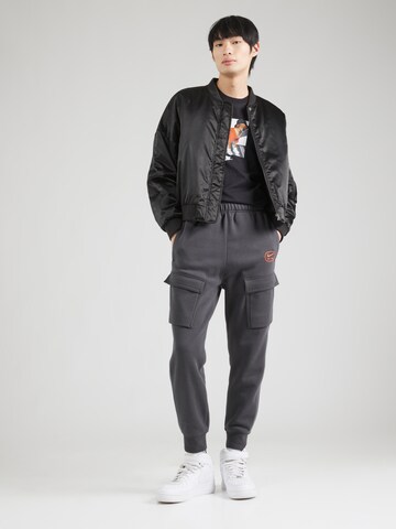 Nike Sportswear Zwężany krój Bojówki 'AIR' w kolorze szary