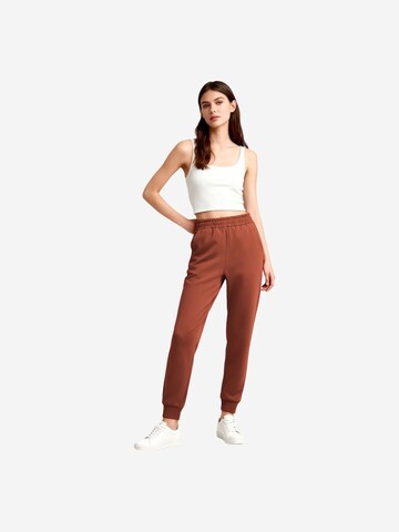 Tommy Life Tapered Sportnadrágok 'Jogginghose' - piros