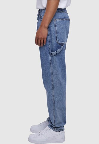 Karl Kani Tapered Jeans in Blau