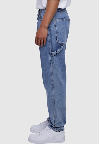 Tapered Jeans di Karl Kani in blu