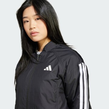 ADIDAS SPORTSWEAR Αθλητικό μπουφάν 'Essentials' σε μαύρο