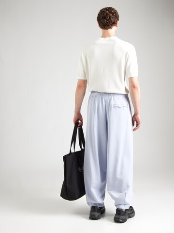 Effilé Pantalon 'CLUB' Nike Sportswear en bleu