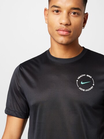 NIKE - Camiseta funcional en negro