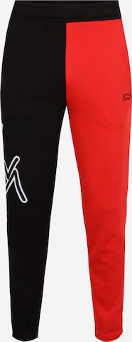 PUMA Tapered Workout Pants in Red: front