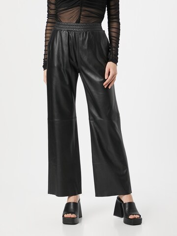 OAKWOOD Loose fit Trousers 'MILA' in Black: front