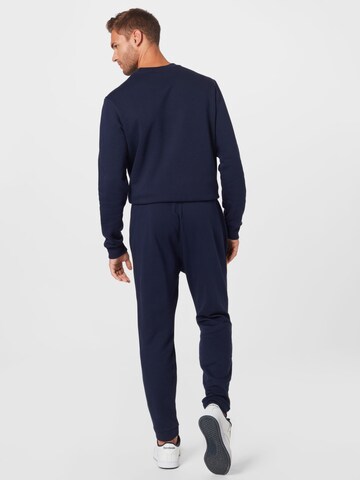 Reebok Tapered Sportbroek in Blauw